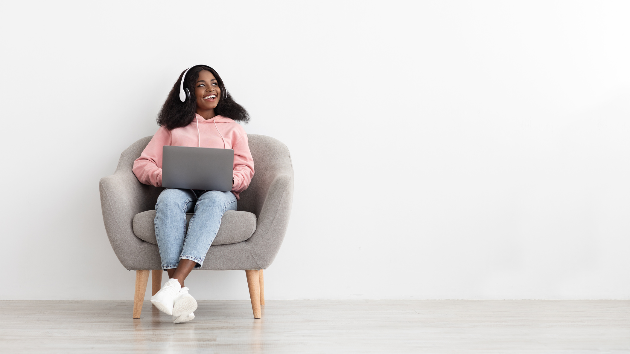 Joyful African American Lady Watching Movie Online, Using Laptop